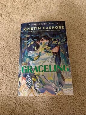 Graceling by Kristin Cashore — Illustrated Blue & Green Paperback